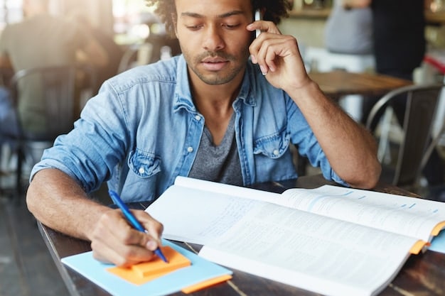 A close-up shot of a student thoughtfully filling out a college application form on a desk cluttered with textbooks, pens, and a laptop displaying a university website. The focus is on the student's concentrated expression and the application form.