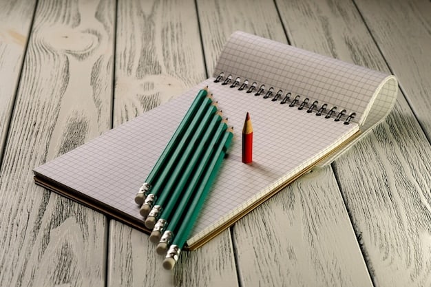 A close-up shot of an SAT test booklet with a #2 pencil on top, surrounded by scattered study materials such as flashcards and practice exams. Only the edge of the booklet is shown to keep the questions obscure.